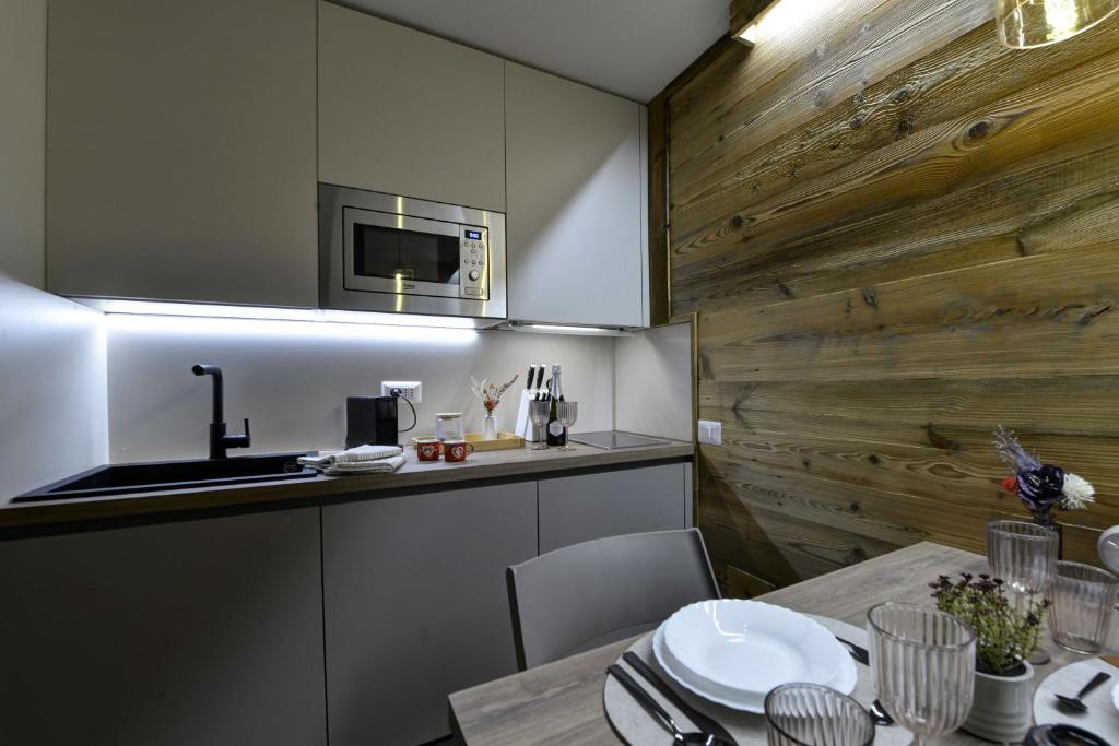 Kuchyň nebo kuchyňský kout v ubytování Petit Grandze, caldo rifugio
