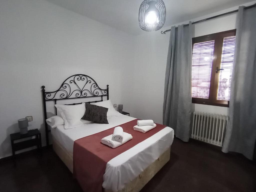 Postel nebo postele na pokoji v ubytování Palacio de Don Juan