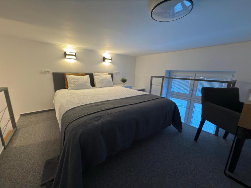 Ένα ή περισσότερα κρεβάτια σε δωμάτιο στο Elena Apartments