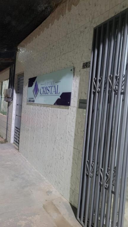 a sign on the side of a building at Hotel Cristal in Barcarena