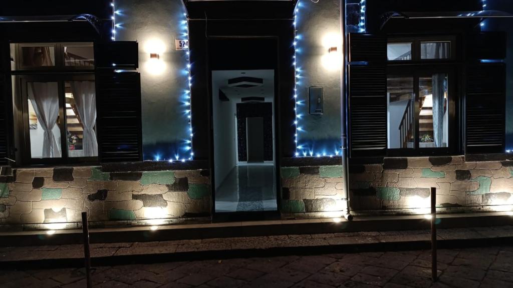 a building with lights on the side of it at night at Porta Garibaldi 1 in Catania