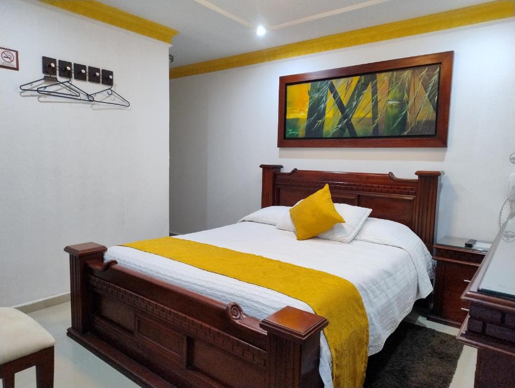Postel nebo postele na pokoji v ubytování Hotel Aires del Quindío Armenia