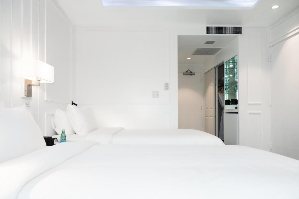 Postel nebo postele na pokoji v ubytování Hotel Tano Guam