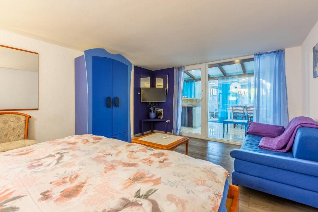 Postel nebo postele na pokoji v ubytování Apartments Mila