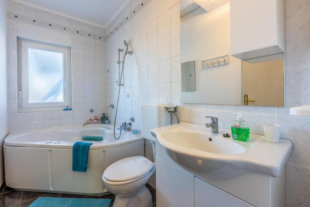 Koupelna v ubytování Apartments Mila