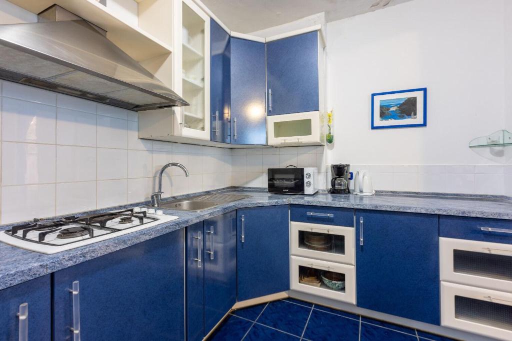 Kuchyň nebo kuchyňský kout v ubytování Apartments Mila