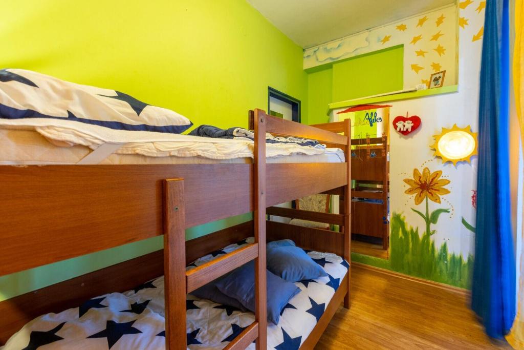 Postel nebo postele na pokoji v ubytování Apartments Mila