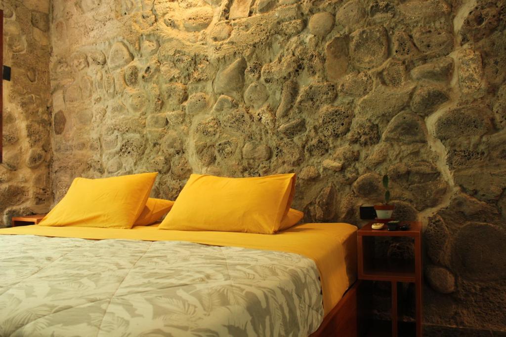 Postel nebo postele na pokoji v ubytování Hostal Pimampiro