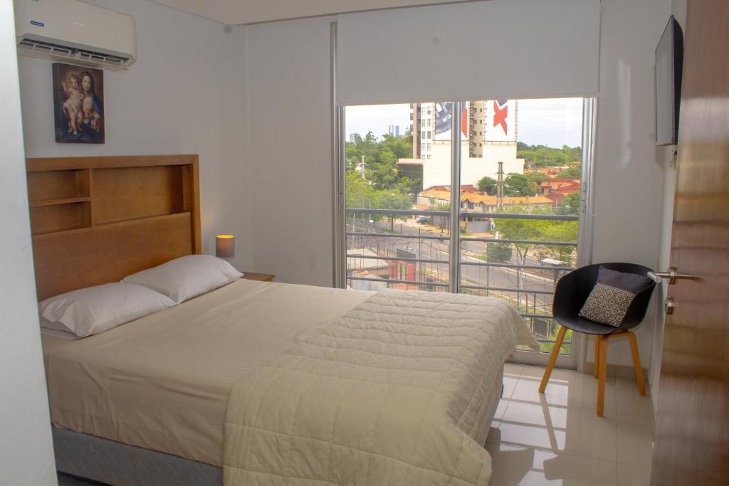 Postel nebo postele na pokoji v ubytování Agradable depto en Asunción