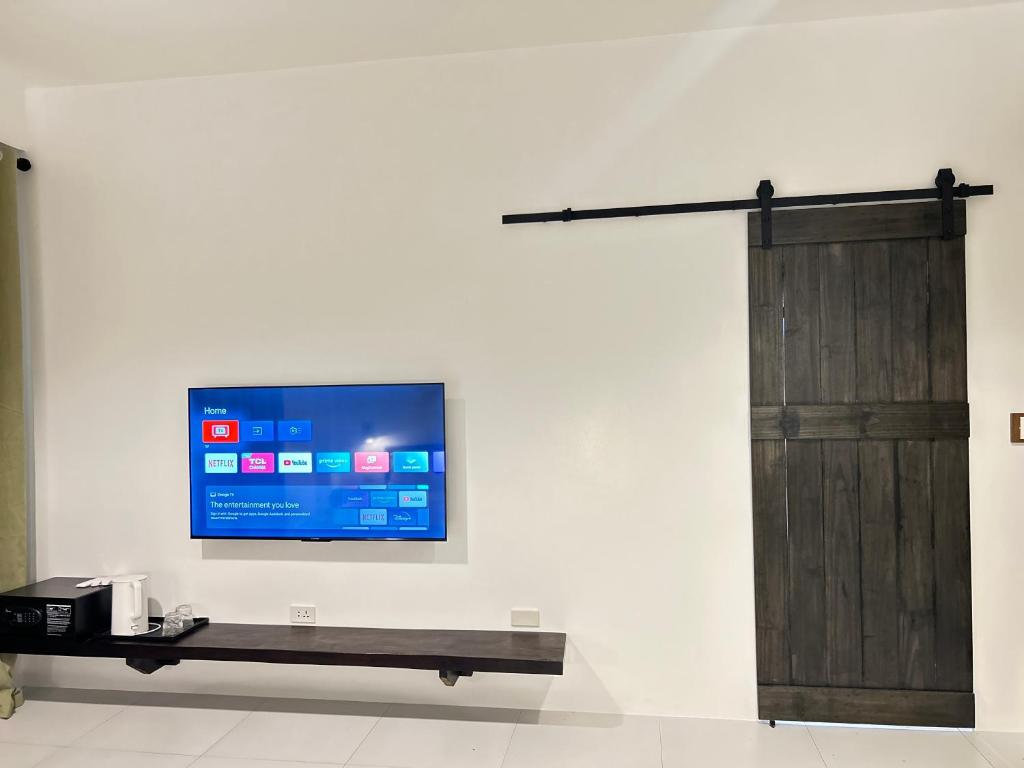 TV a/nebo společenská místnost v ubytování La Bonitovilla 丛林里的花园别墅