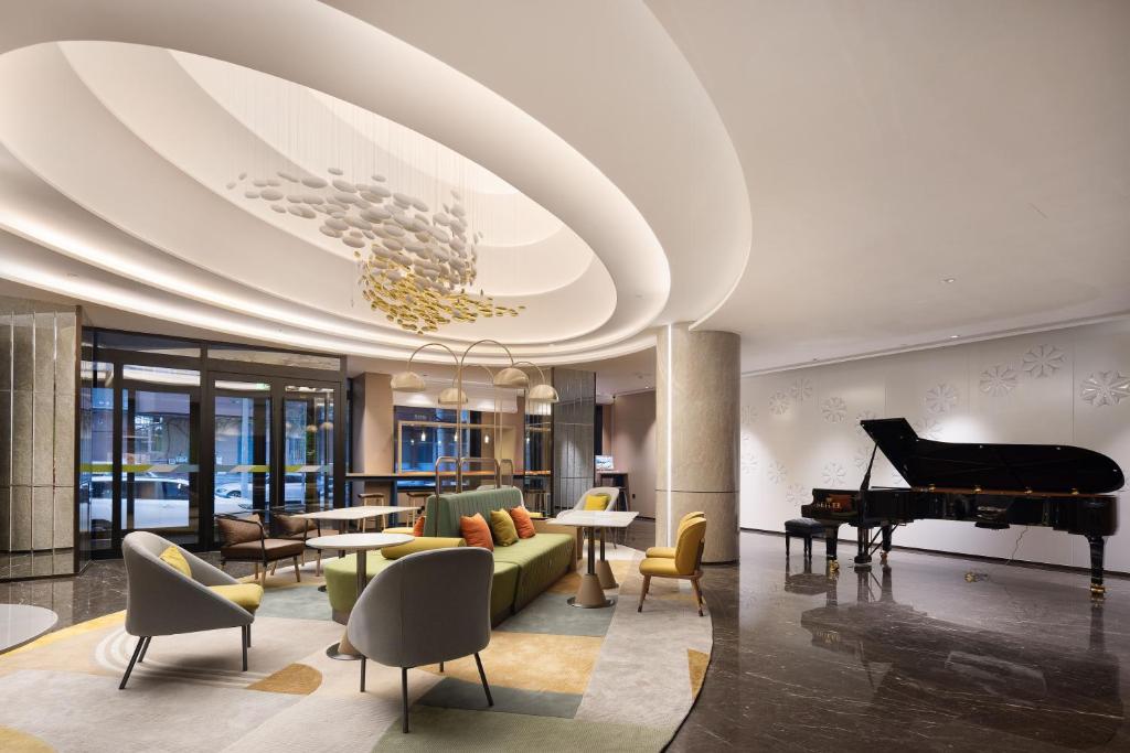 Posezení v ubytování Home2 Suite by Hilton Harbin Central Street