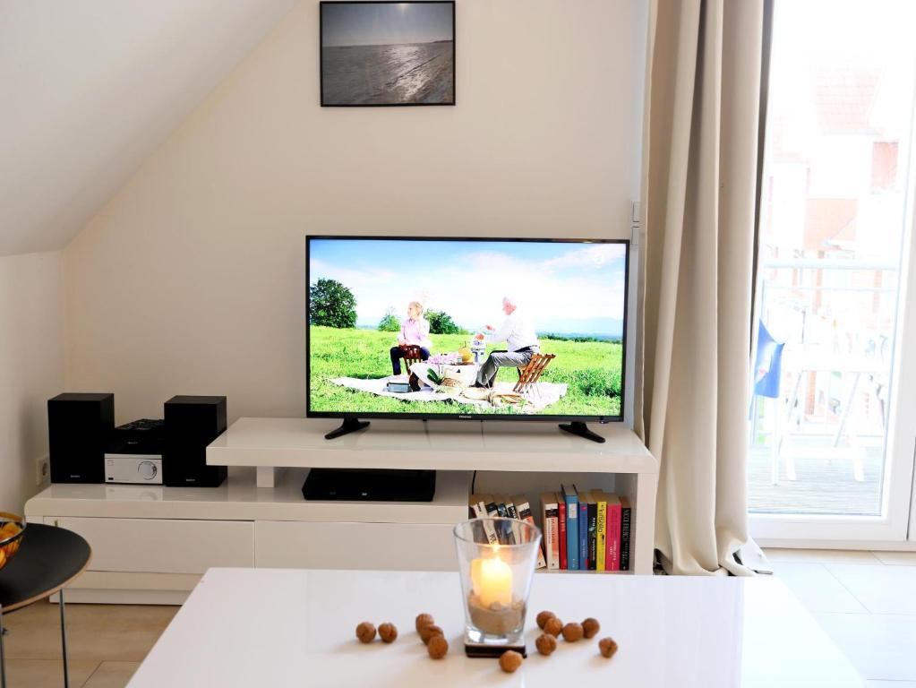 TV a/nebo společenská místnost v ubytování Dünengrund 3, W6