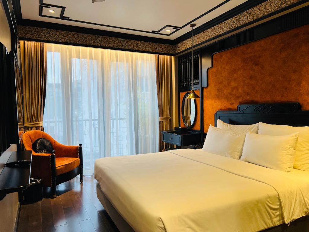 Postel nebo postele na pokoji v ubytování Hotel du Monde Classic