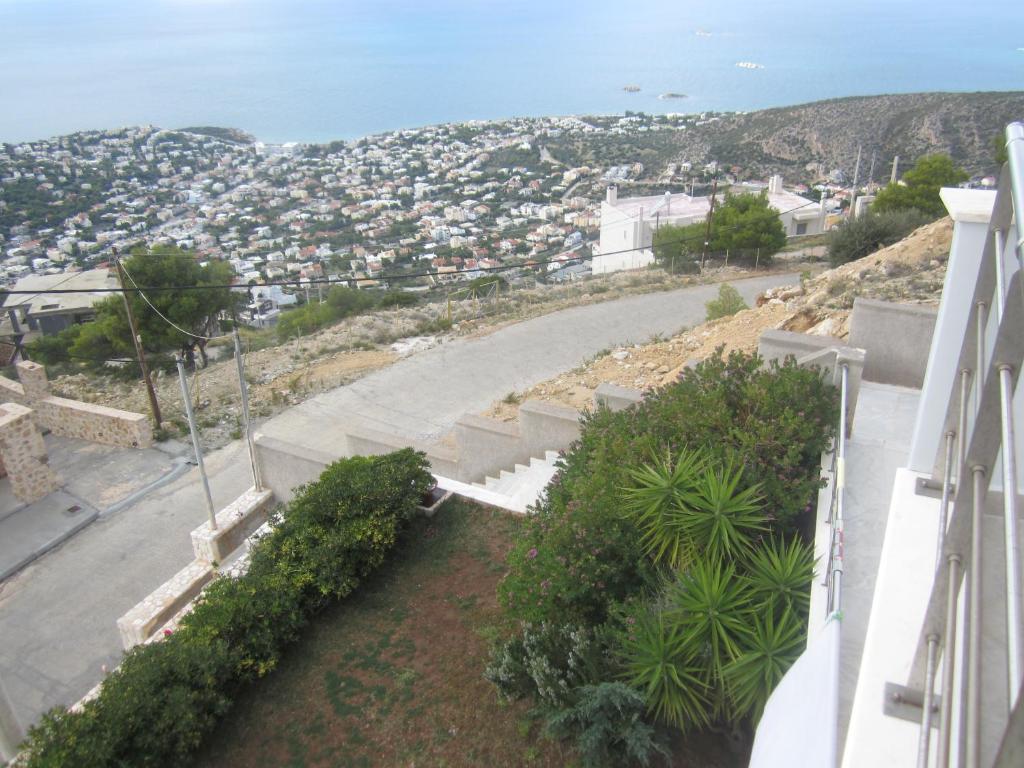 a view of a city from the balcony of a building at Viva B&B in Anavyssos