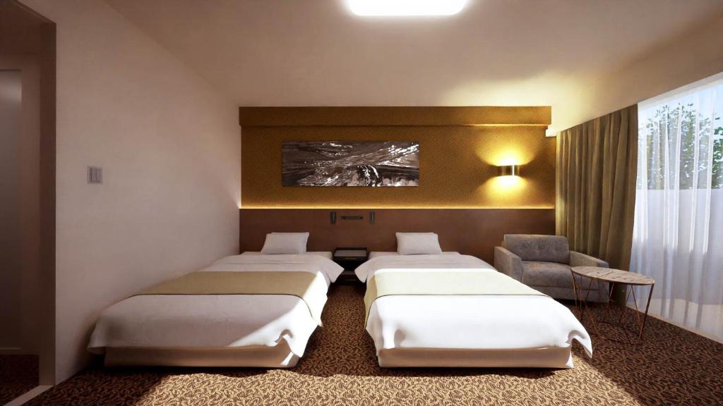 Postel nebo postele na pokoji v ubytování UE Garden Resort