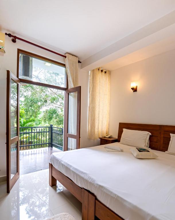 Postel nebo postele na pokoji v ubytování Abhayawewa Resort
