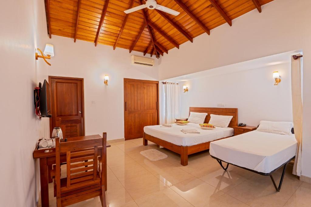 Postel nebo postele na pokoji v ubytování Abhayawewa Resort