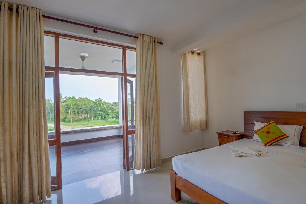 Postel nebo postele na pokoji v ubytování Abhayawewa Resort