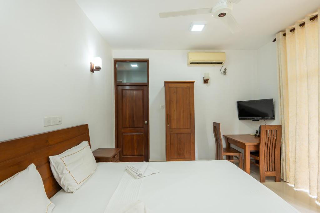 Postel nebo postele na pokoji v ubytování Abhayawewa Resort