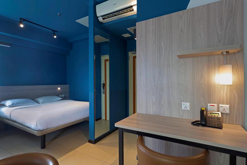 Postel nebo postele na pokoji v ubytování ibis budget Phnom Penh Riverside