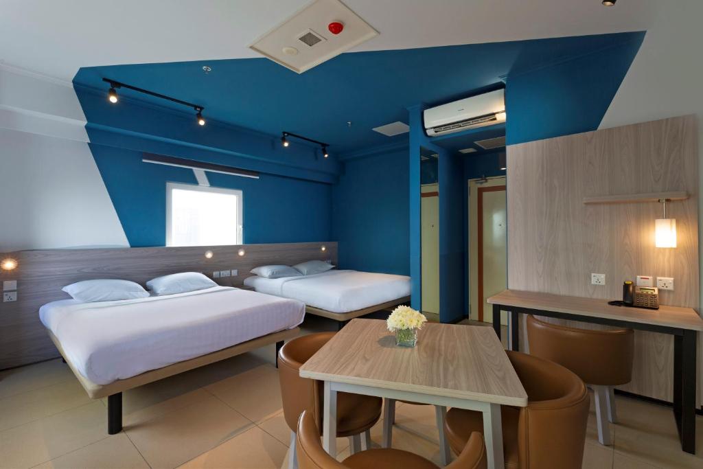 Postel nebo postele na pokoji v ubytování ibis budget Phnom Penh Riverside