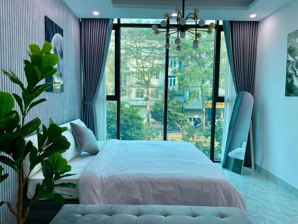 Postel nebo postele na pokoji v ubytování The Grand Diamond C Tuong Mai