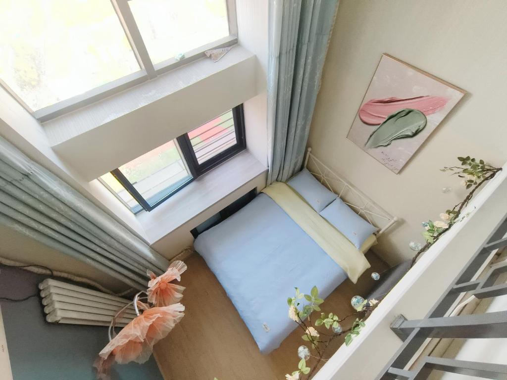 Postel nebo postele na pokoji v ubytování Yu Jing Xuan Boutique Apartment