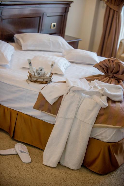 Postel nebo postele na pokoji v ubytování Hotel Rexton