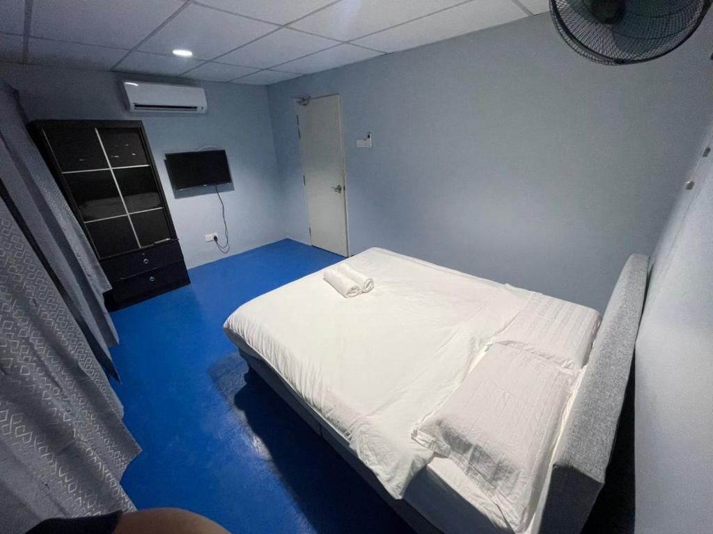 Postel nebo postele na pokoji v ubytování M Straits Hotel
