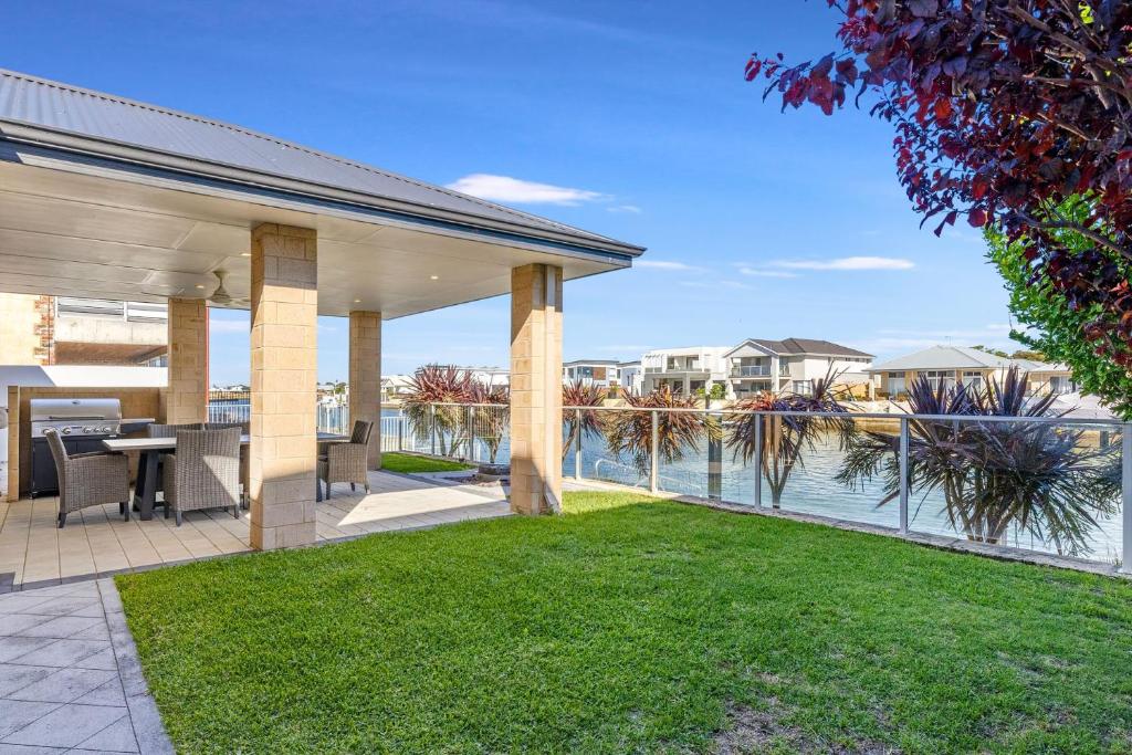 an outdoor patio with a view of the water at Windward Marina Retreat in Geographe