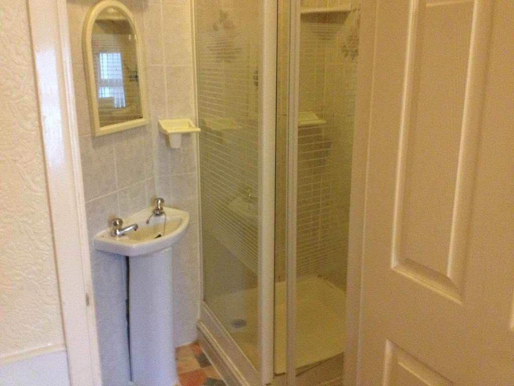 a bathroom with a sink and a shower at Bel Reve Hotel in Blackpool