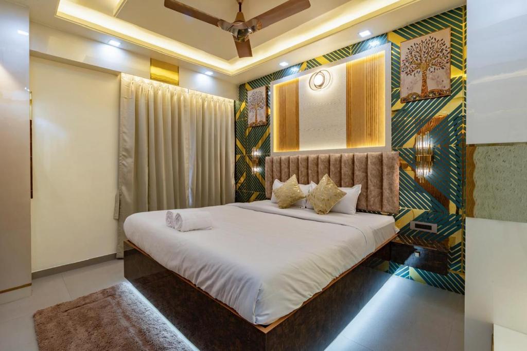 a bedroom with a large bed in a room at Goa Riviera in Goa