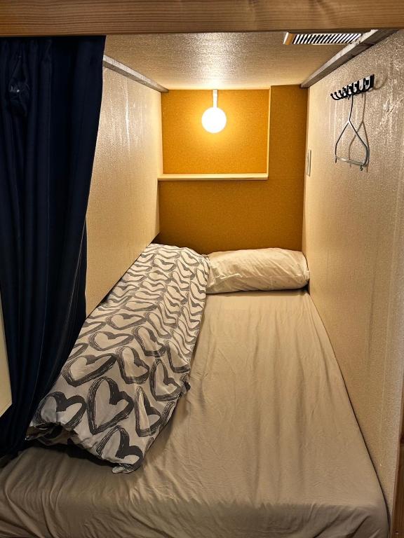 Postel nebo postele na pokoji v ubytování Hostel Furoya