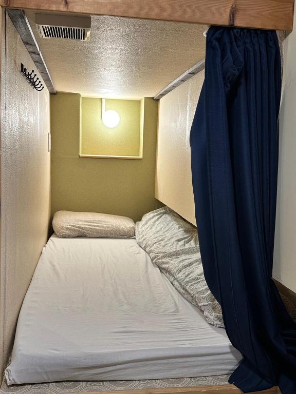 Postel nebo postele na pokoji v ubytování Hostel Furoya