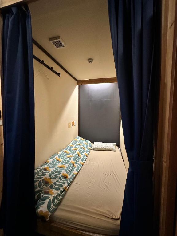 Postel nebo postele na pokoji v ubytování Hostel Furoya