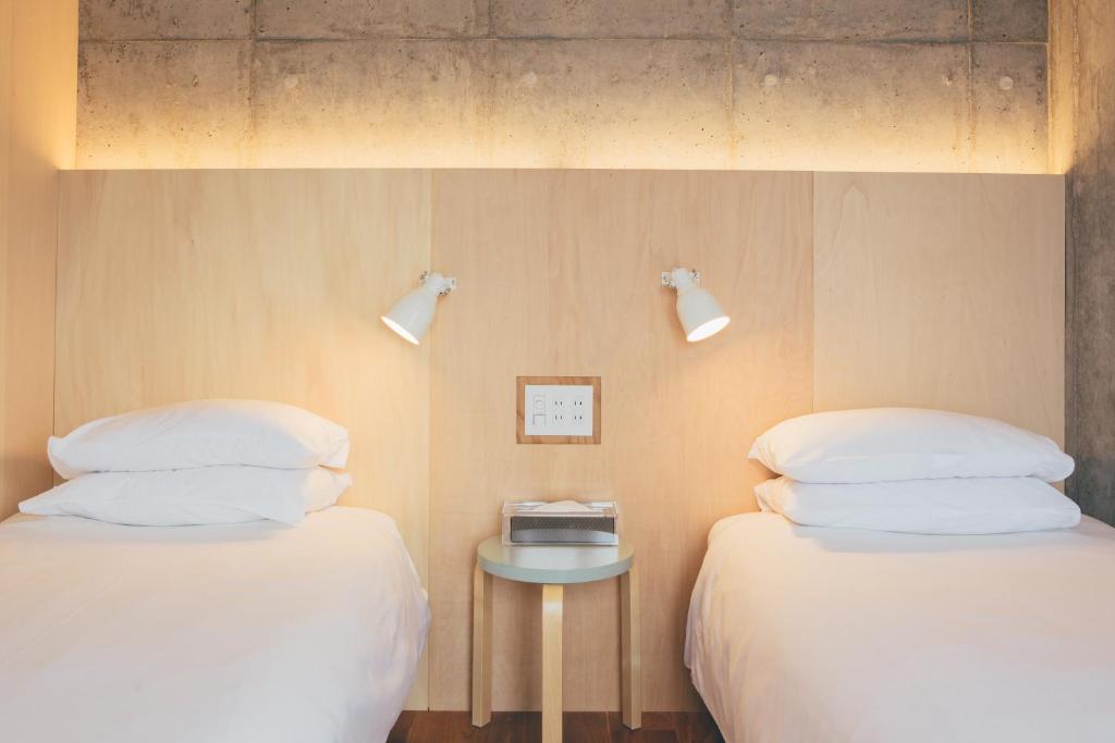 Postel nebo postele na pokoji v ubytování DOMO Hotel