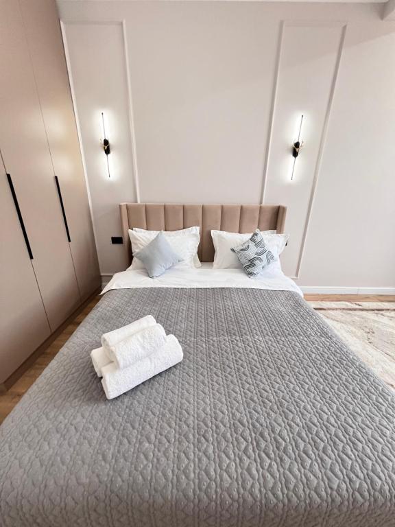 Postel nebo postele na pokoji v ubytování Capital city, Жилой комплекс