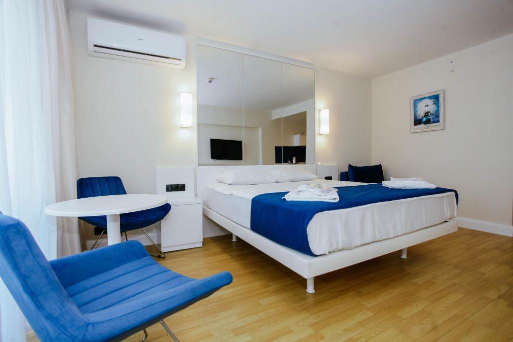 Postel nebo postele na pokoji v ubytování Batumi Sea Line Aparthotels