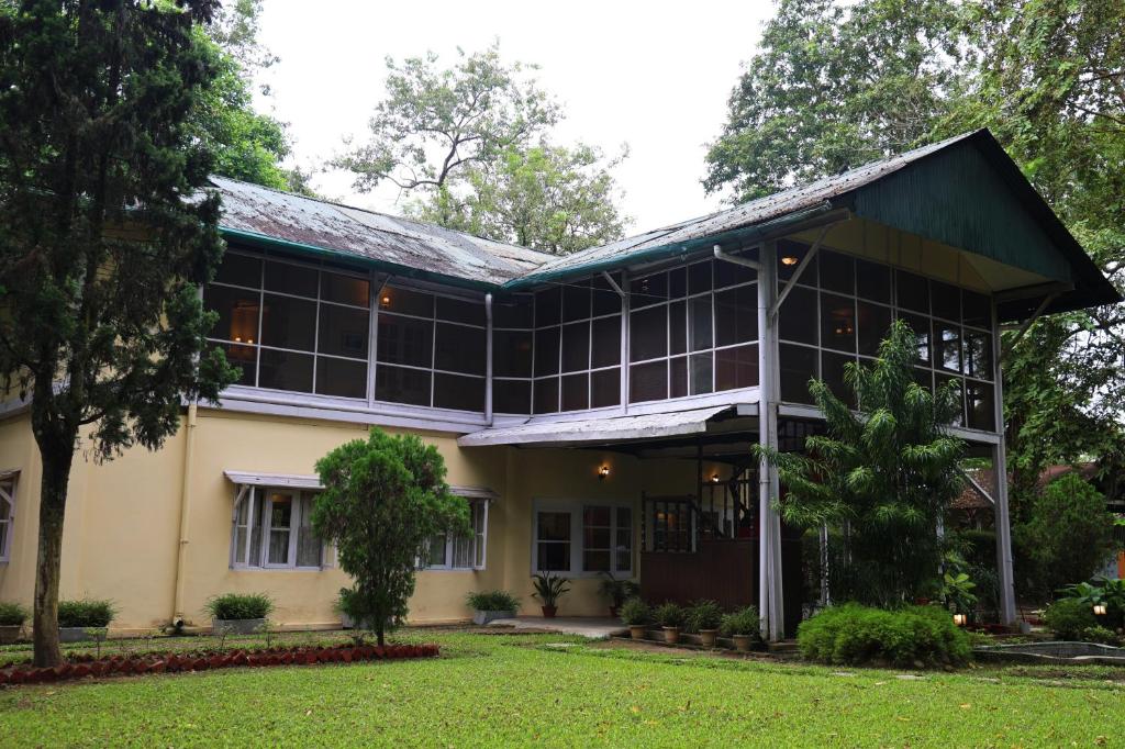 an exterior view of a building at Chowkidinghee Heritage Tea Bungalow in Dibrugarh