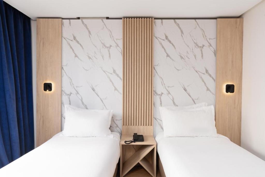 Postel nebo postele na pokoji v ubytování Rihab Hotel