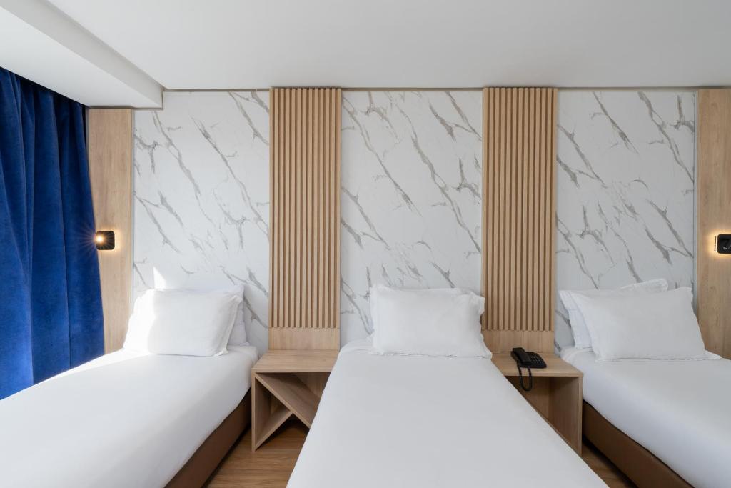 Postel nebo postele na pokoji v ubytování Rihab Hotel