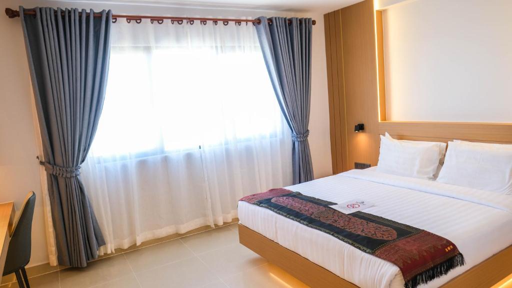 Postel nebo postele na pokoji v ubytování Silver Mounts Hotel