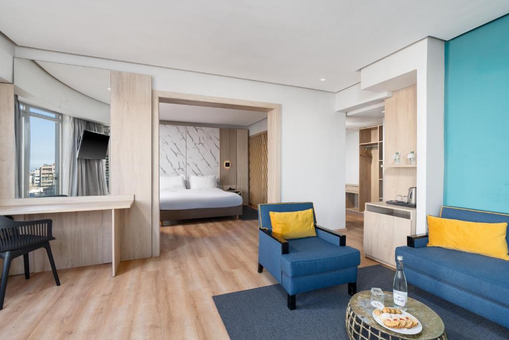 Postel nebo postele na pokoji v ubytování Rihab Hotel