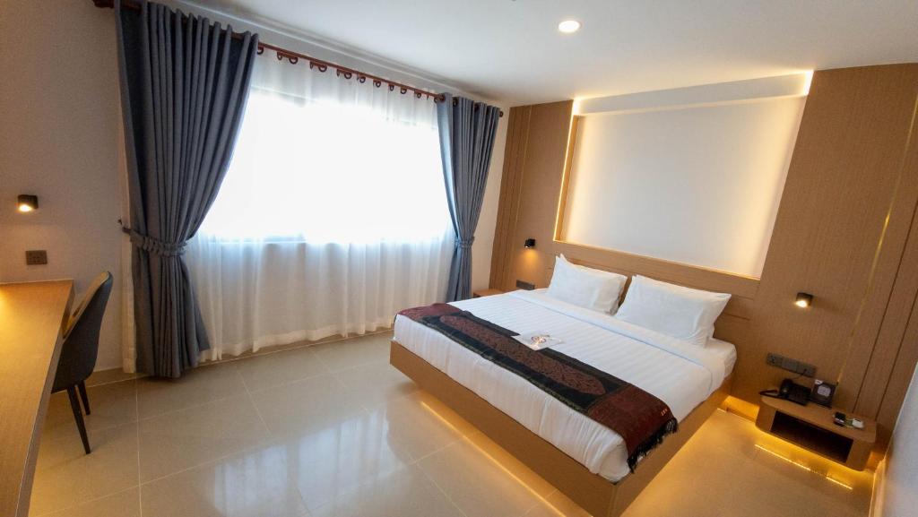 Postel nebo postele na pokoji v ubytování Silver Mounts Hotel