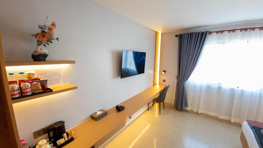 TV a/nebo společenská místnost v ubytování Silver Mounts Hotel