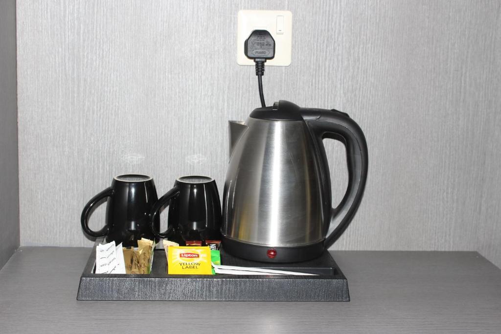 Příslušenství pro přípravu čaje a kávy v ubytování Vista Hotel Tabuk
