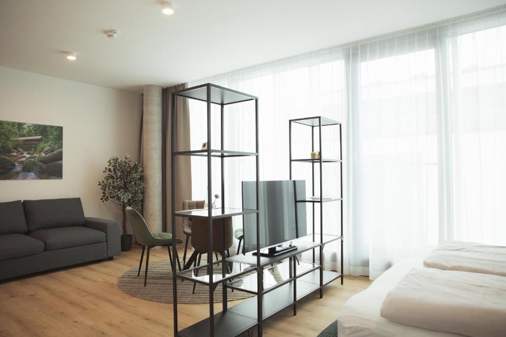 Postel nebo postele na pokoji v ubytování Black Forest Suites
