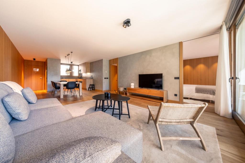 a living room with a couch and a table at ISARD HOMES & SPA BY SELECT RENTALS in El Tarter