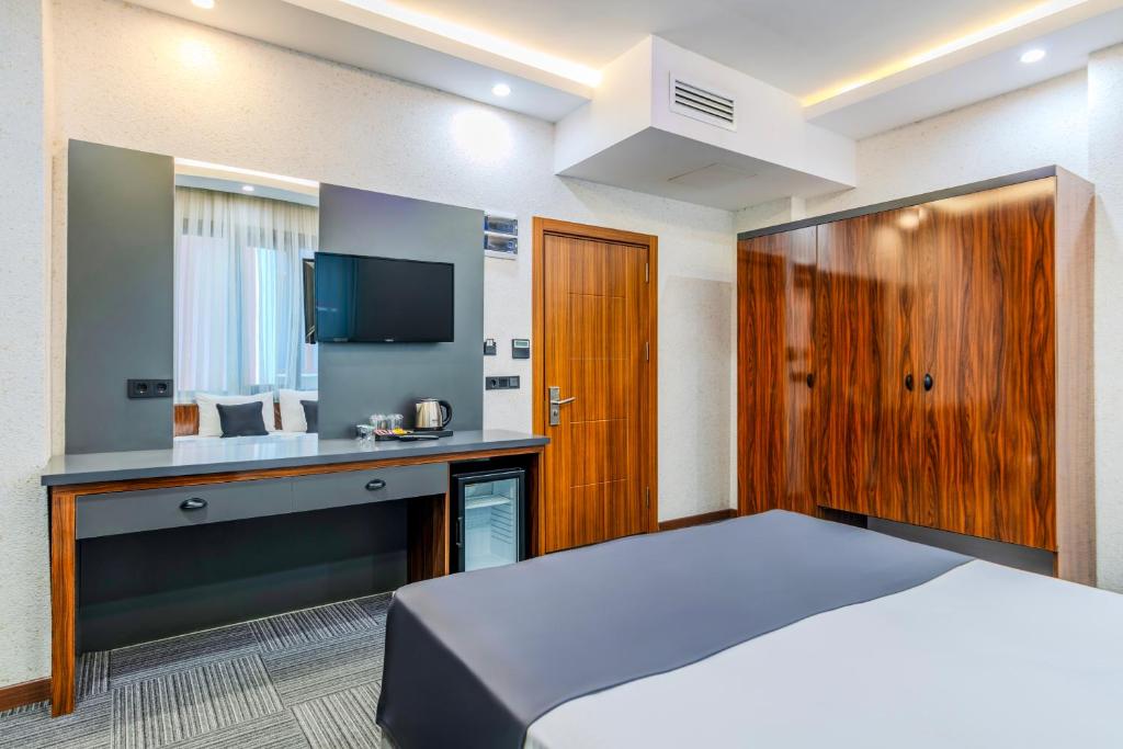 Postel nebo postele na pokoji v ubytování MED Airport Hotel