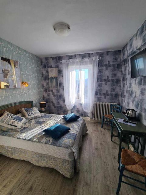 Letto o letti in una camera di Hotel Belle Vue
